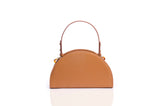 Tan grainy leather taco-shaped handbag with a structured handle and gold-tone hardware details.