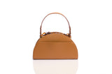 Tan grainy leather taco-shaped handbag with a top handle and decorative tortoiseshell chain detail.