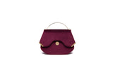 Wine red velvet Calypso top handle bag with gold-tone hardware and designer logo, 23cm wide elegant evening accessory.