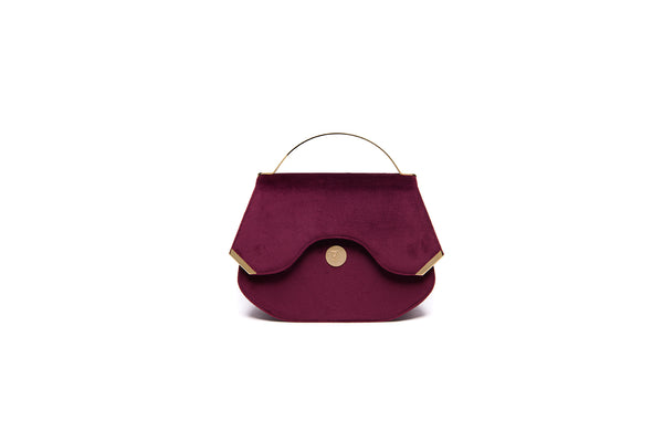 Wine red velvet Calypso top handle bag with gold-tone hardware and designer logo, 23cm wide elegant evening accessory.