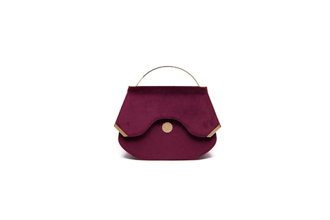 Wine red velvet Calypso top handle bag with gold-tone hardware and designer logo, 23cm wide elegant evening accessory.