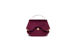 Wine red velvet Calypso top handle bag with gold-tone hardware and designer logo, 23cm wide elegant evening accessory.